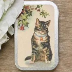 Karamellipastillit Kissa kello kaulassaan